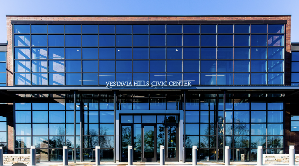 Exterior view of the Vestavia Hills Civic Center with large glass windows and a modern architectural design.