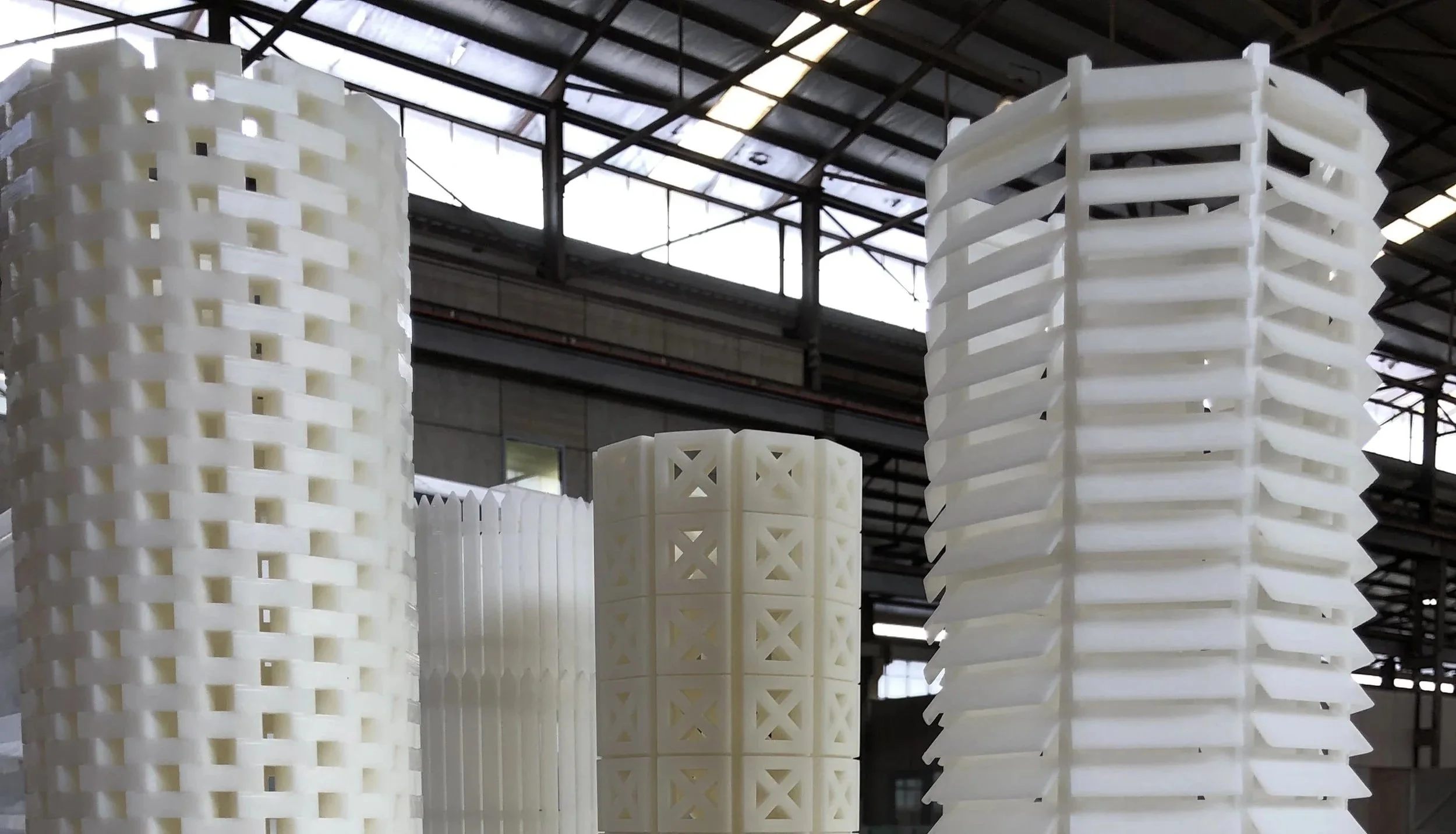Large white plastic lattice structures depicting the process of creating Safe as Houses artwork at SLQ