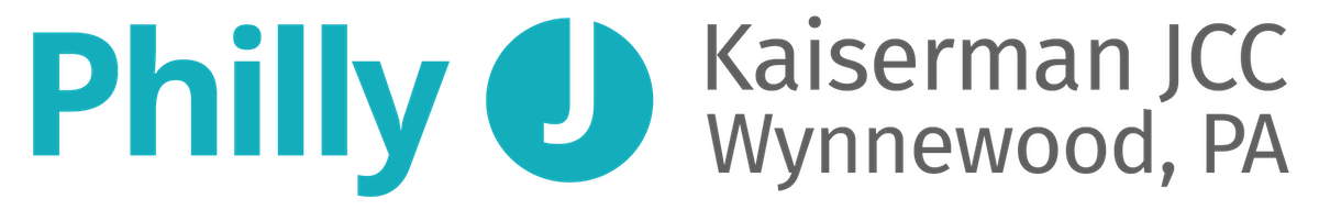 Logo for Philly Kaiser Permanente JCC Wynnewood, PA, with blue and black text and a blue circle icon.