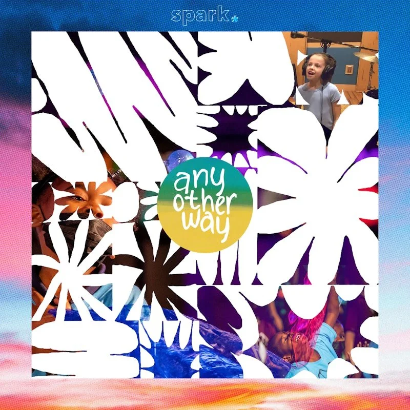 Children in a recording studio, some wearing headphones, singing or speaking into microphones. The studio has warm lighting and sound equipment visible.