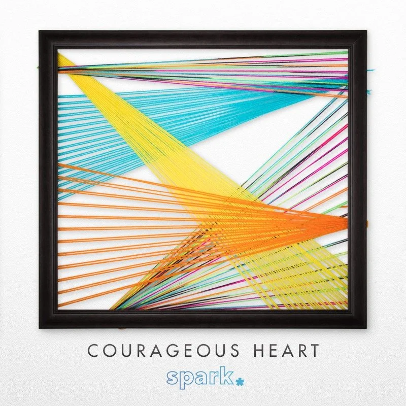 Colorful string art titled 'Courageous Heart' featuring intersecting strings in a black frame.