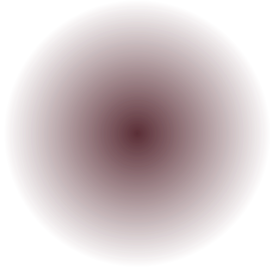 Blurred image with concentric circular color patterns in shades of red, pink, and purple.