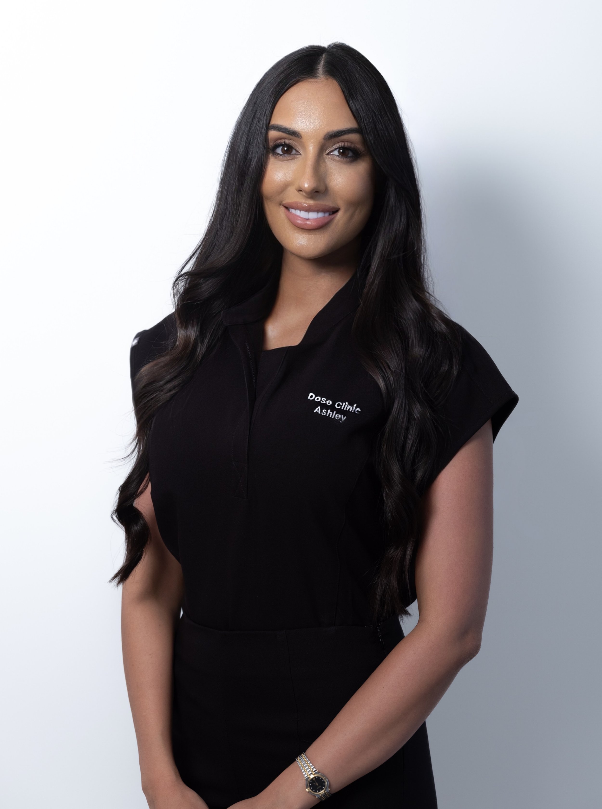 Ashley smiling in Dose Clinic uniform against white background:
Ashley co-founder and lead dermal therapist Dose Clinic Brisbane | Regenerative skin treatments West Village West End