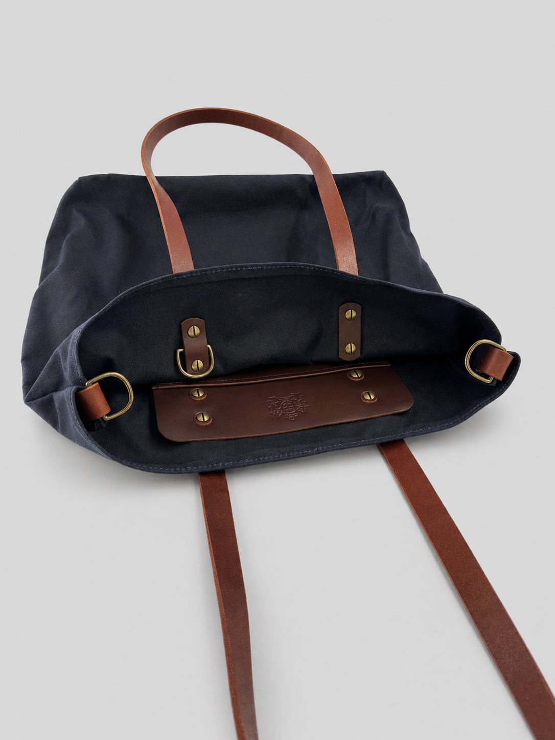 Navy waxed canvas with antique brass hardware