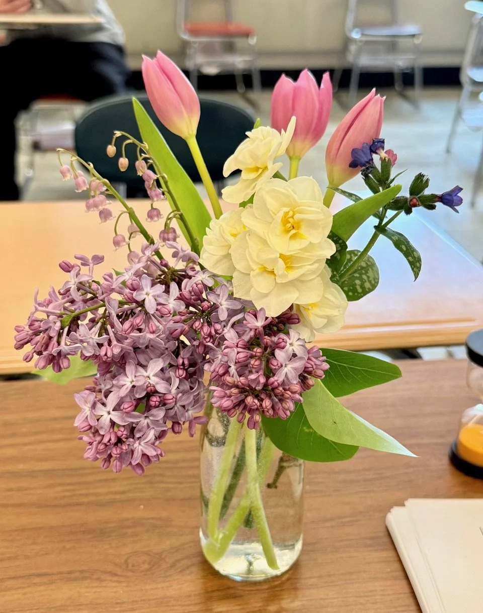 Fresh flowers arrangement in vase.