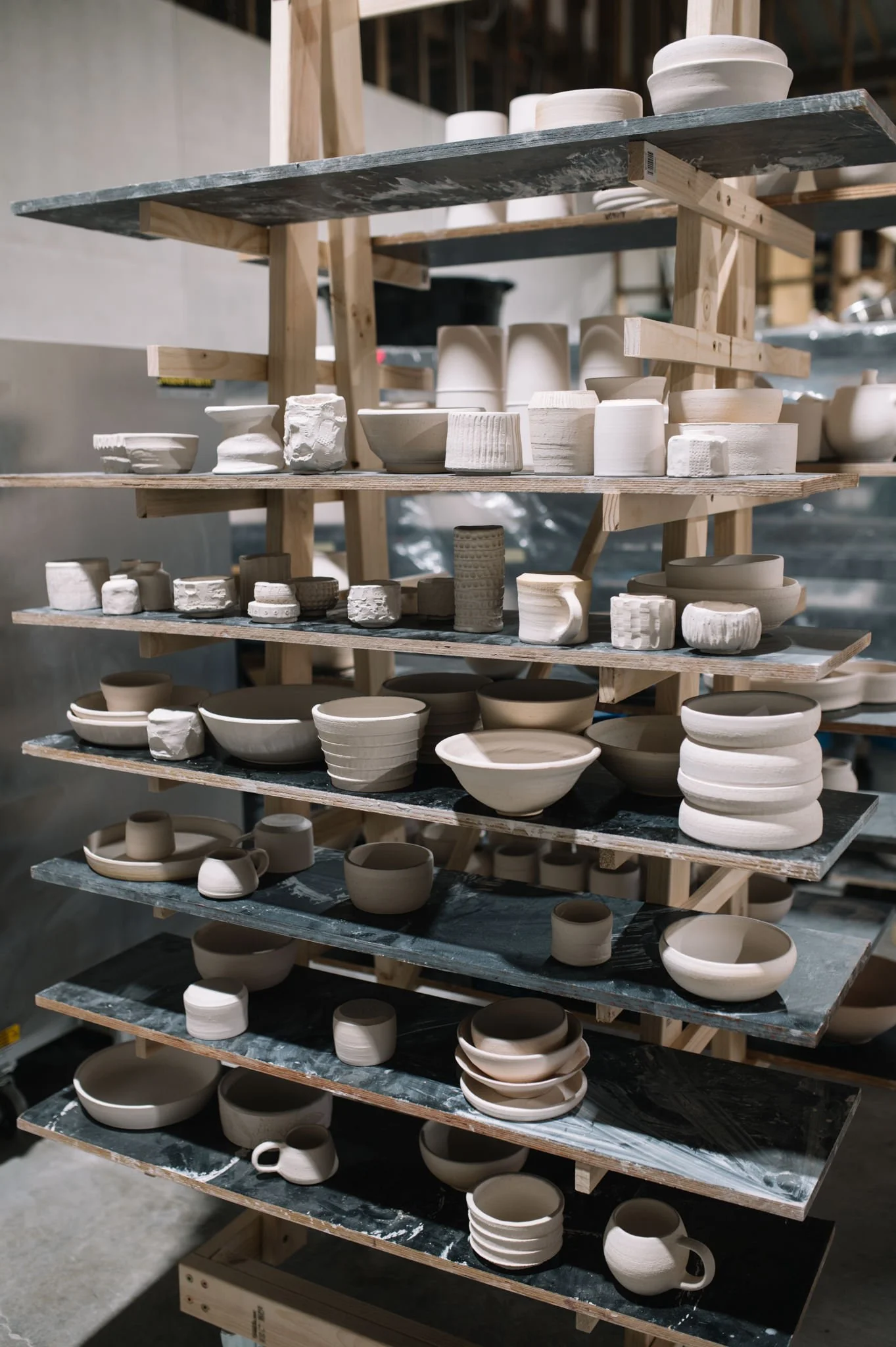 handmade pottery drying on shelves in huon valley studio
