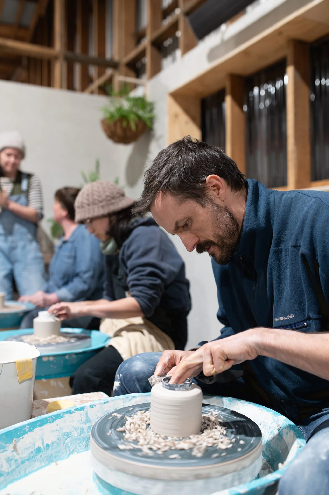 student learning wheel throwing pottery in huon valley studio