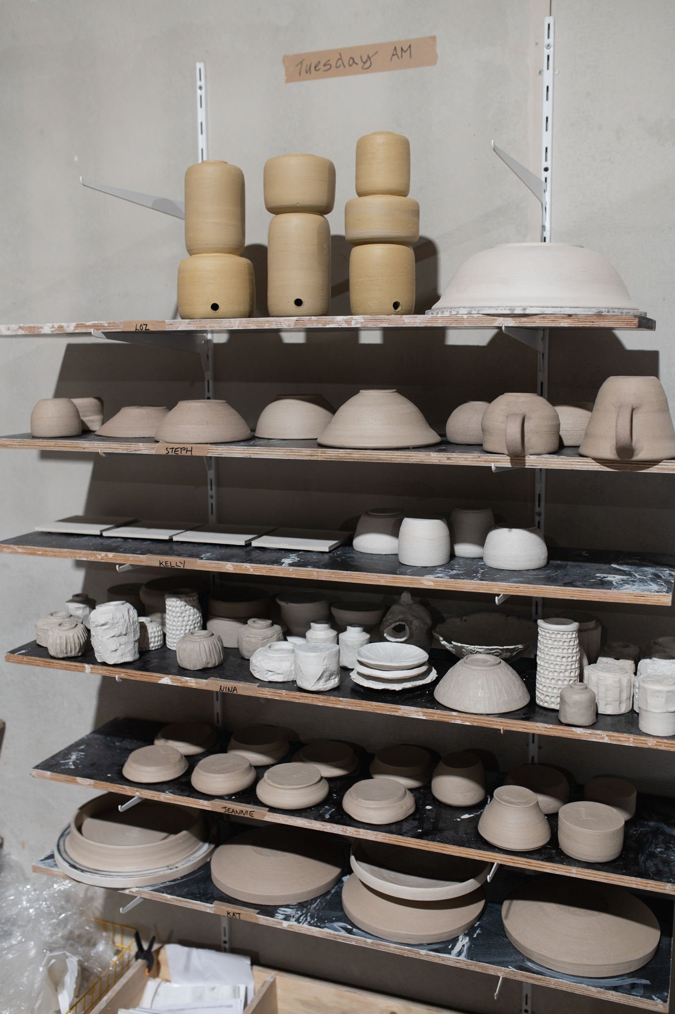 handmade ceramics on shelves in pottery studio tasmania