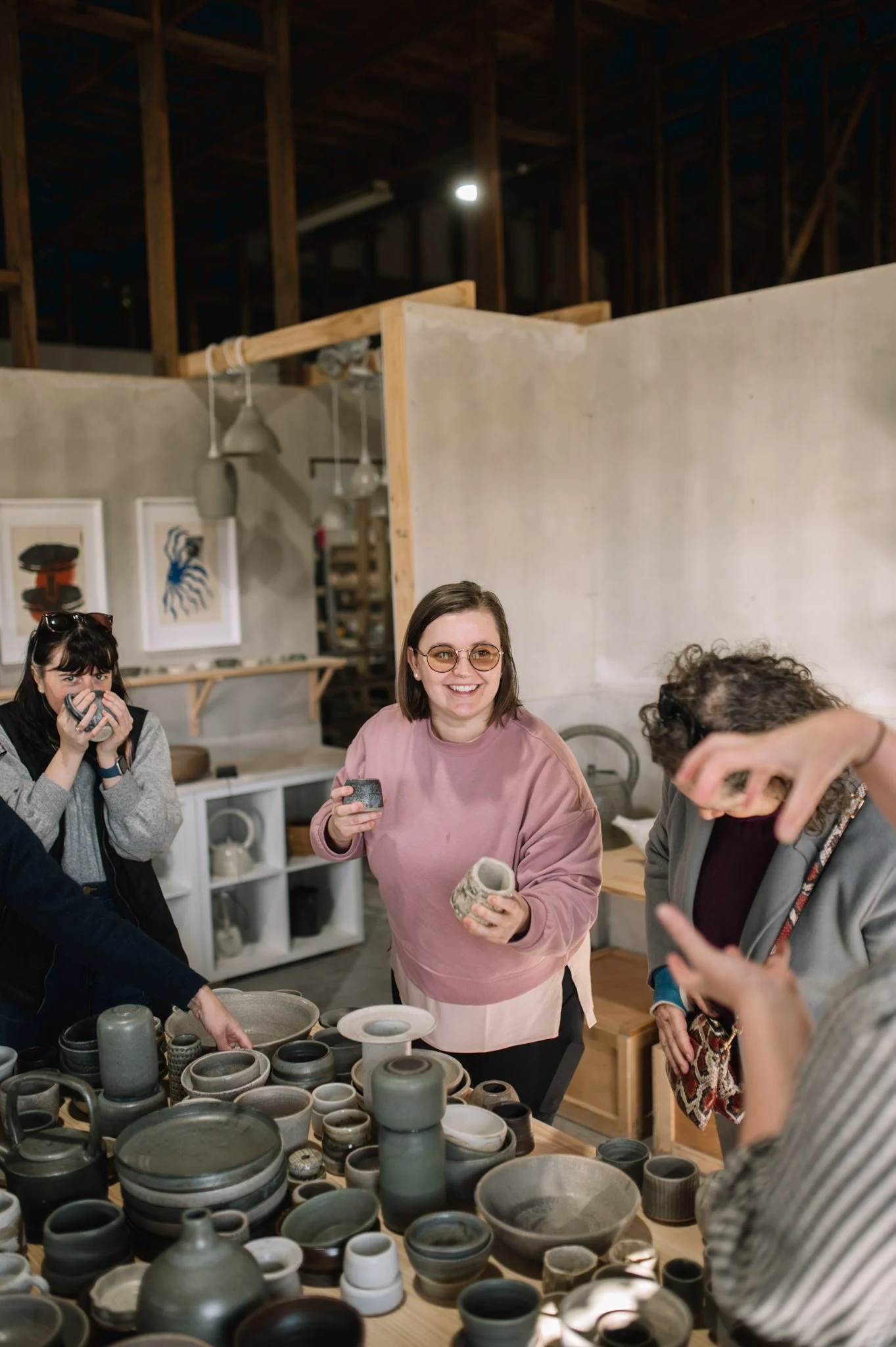 students collecting handmade ceramics in huon valley pottery studio