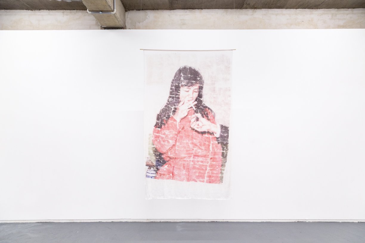  The Artist's Mother?   
2025.  
Inkjet print transfer via ‘Gardenia’ by Zara on silk.  
188 x 114 cm.  
Documentation by Panisa Ongwat.