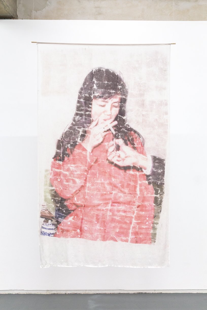  The Artist's Mother?   
2025.  
Inkjet print transfer via ‘Gardenia’ by Zara on silk.  
188 x 114 cm.  
Documentation by Panisa Ongwat.