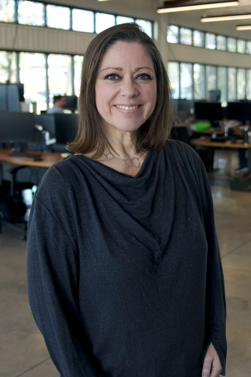 Brandi, quilt maker and founder of Stitch Happens Creative, specializing in custom memory quilts made from clothing.