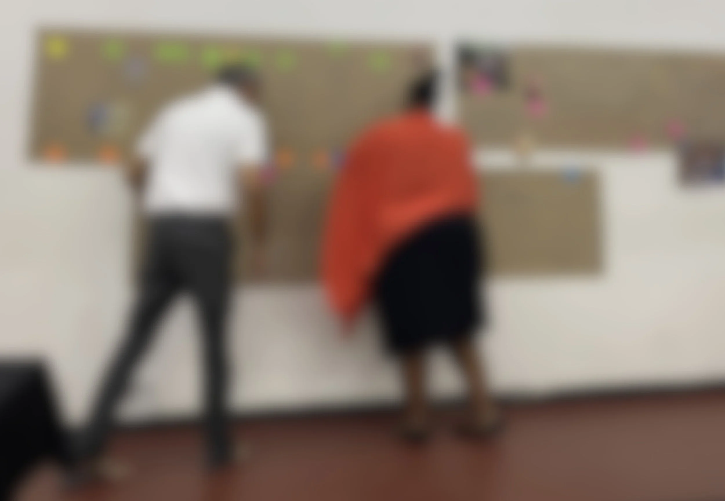 Workshop participants working on a timeline map, blurred photo