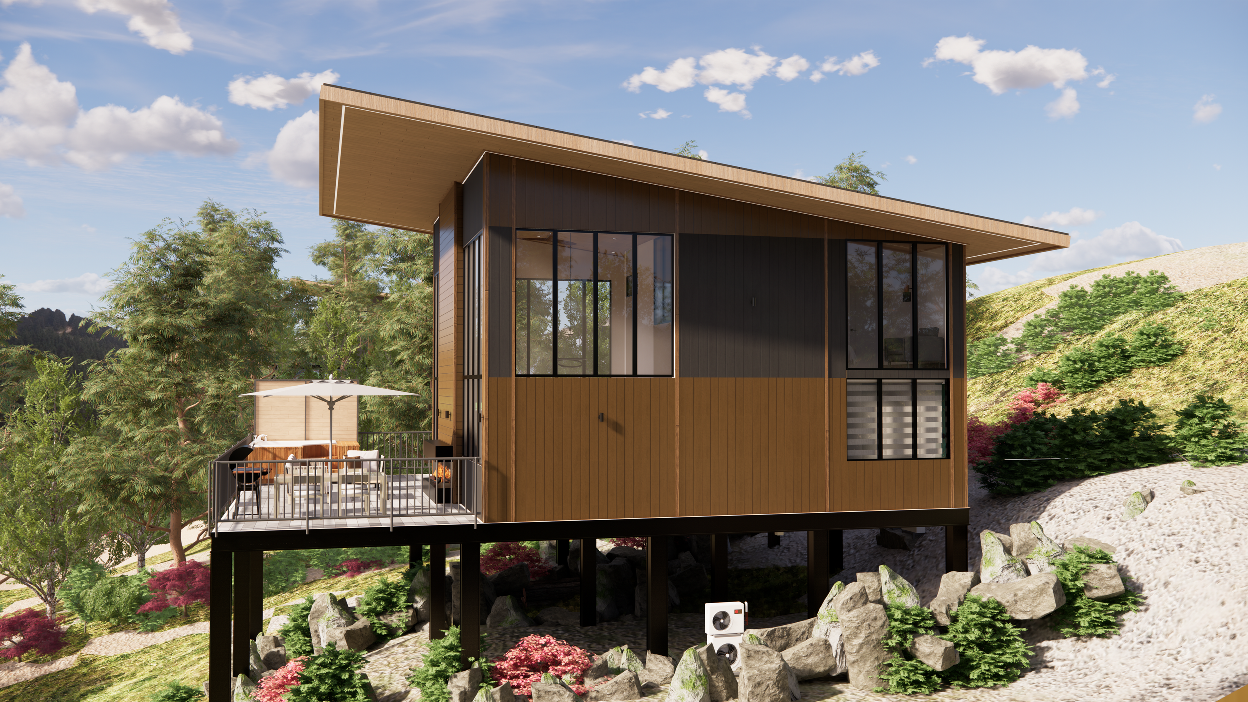 A modern house on stilts with large windows and a sloped roof, set in a green landscape with trees, rocks, and colorful bushes, under a partly cloudy sky.