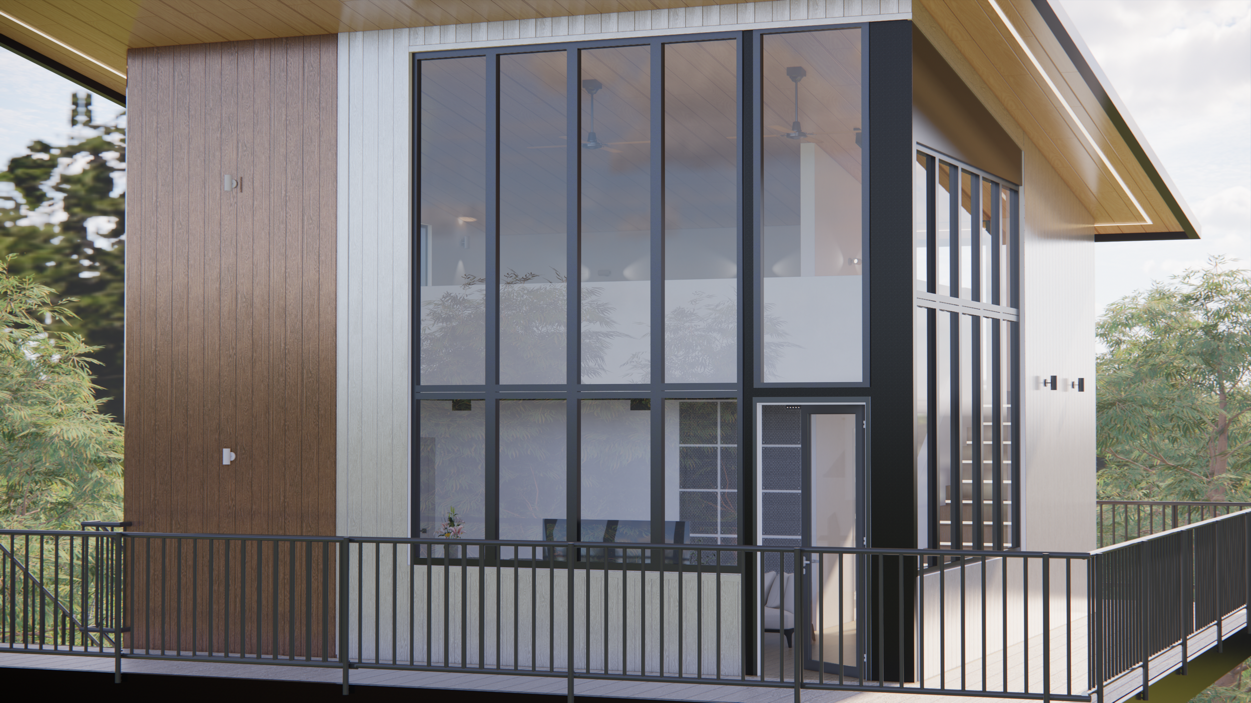 Front view of a modern house with large glass windows, a wooden and metal exterior, and a balcony with a black railing surrounded by trees.