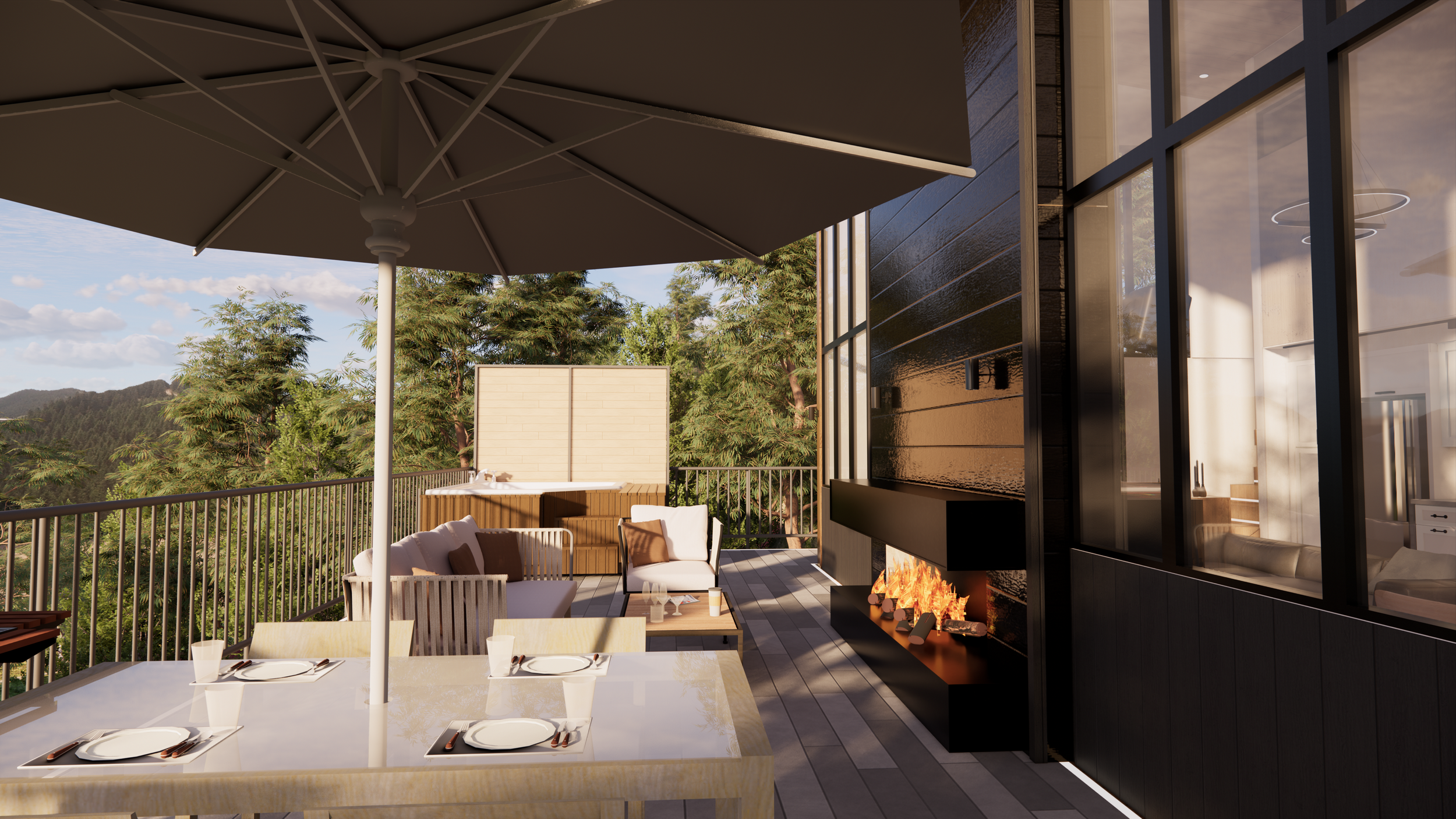 Exterior balcony patio with dining table, umbrella, seating area, and fireplace, overlooking trees and mountains during daytime.