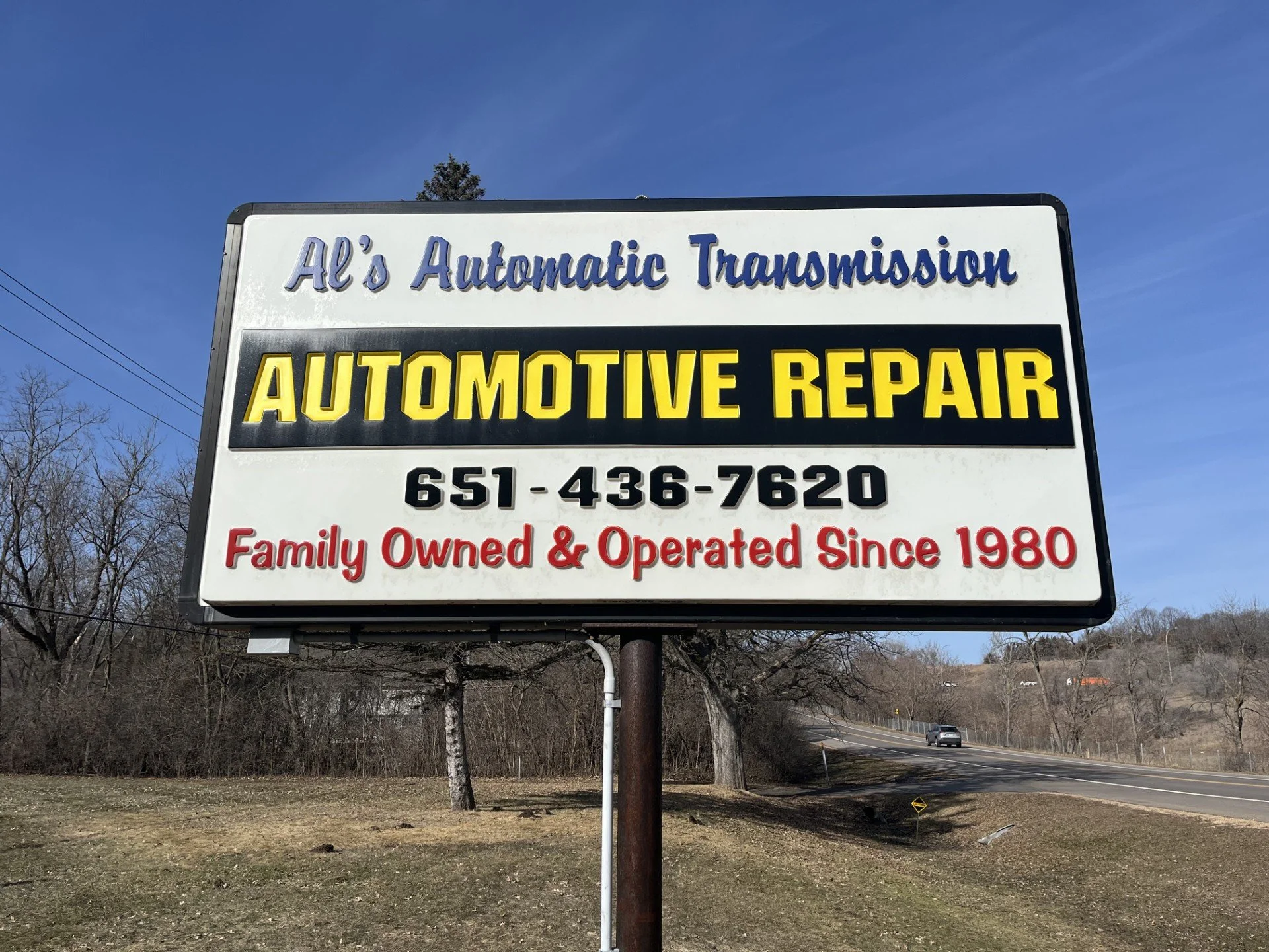 Sign for Al's Automatic Transmission and Automotive Repair with phone number 651-436-7620 and information that it is family owned and operated since 1980.