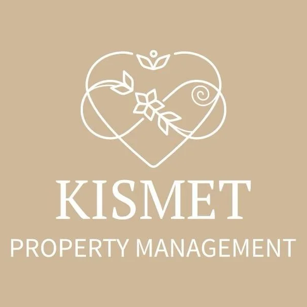 Logo for Kismet Property Management featuring a heart shape with floral and vine designs above the company name