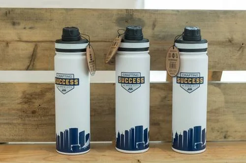 Three water bottles with the Milwaukee skyline'