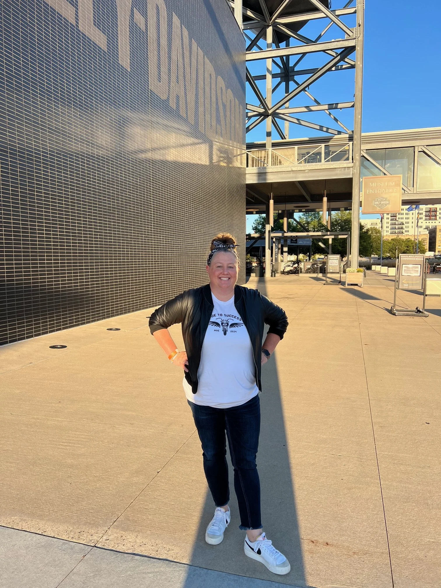 Woman standing in front of the Harley Davidson Museum
