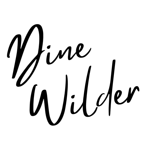 Signature-style black text reading 'Dine Wilder' on a white background.