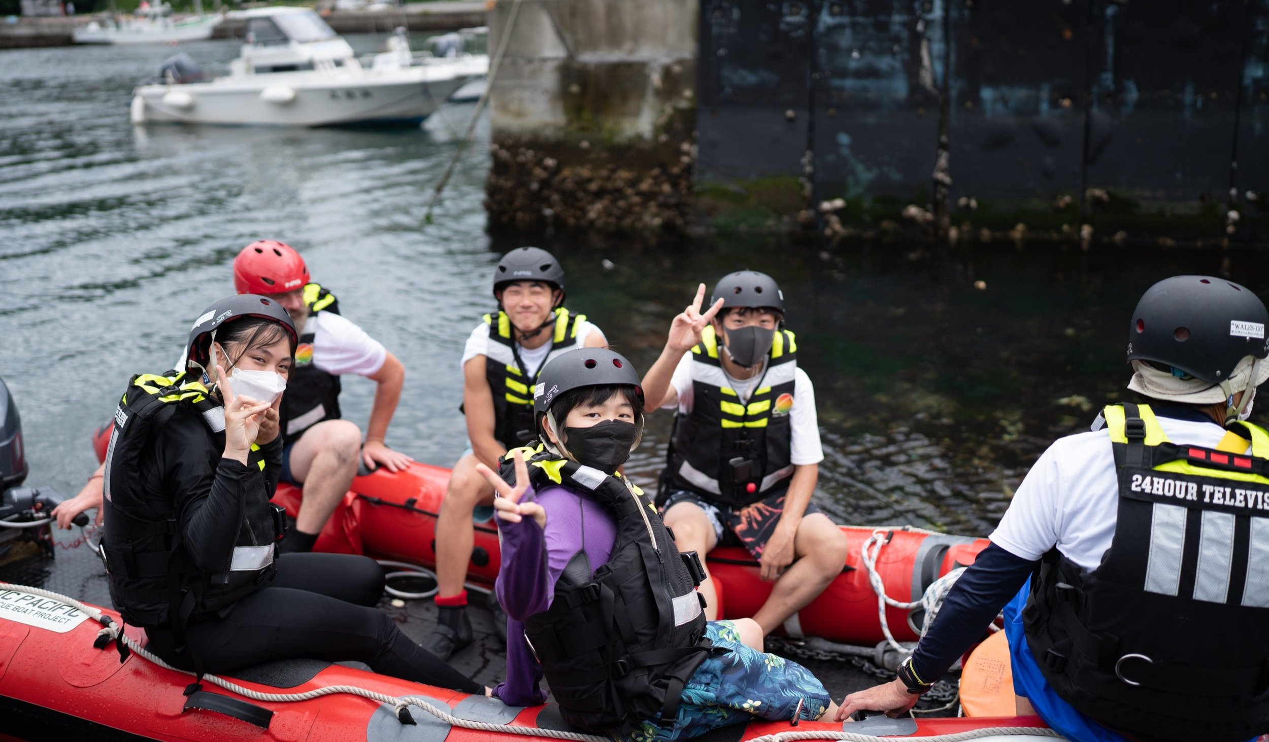 young people on boat at summer camp
