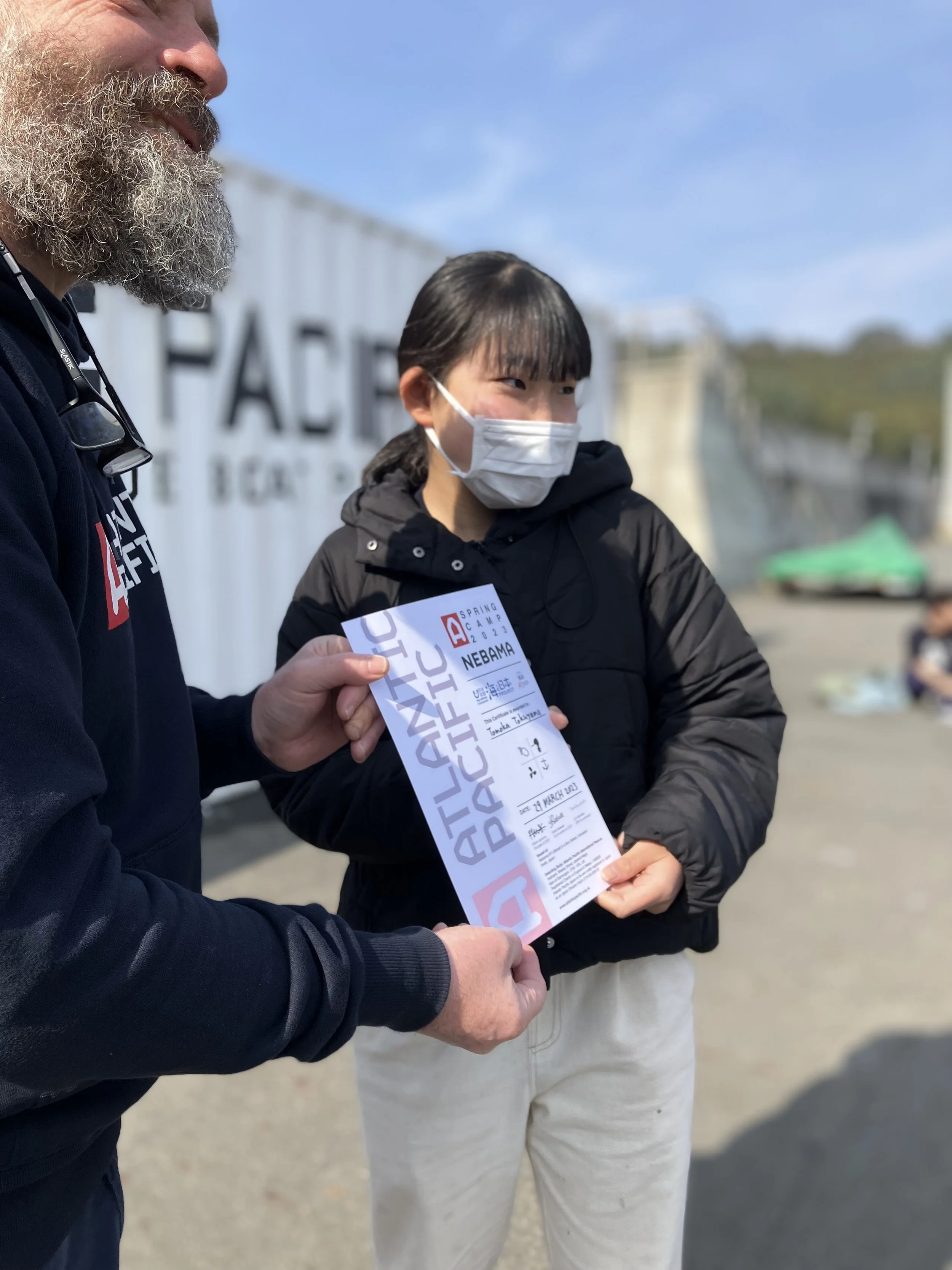 young girl receiving certificate at summer camp