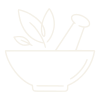 A bowl with a spoon and some leaves inside
