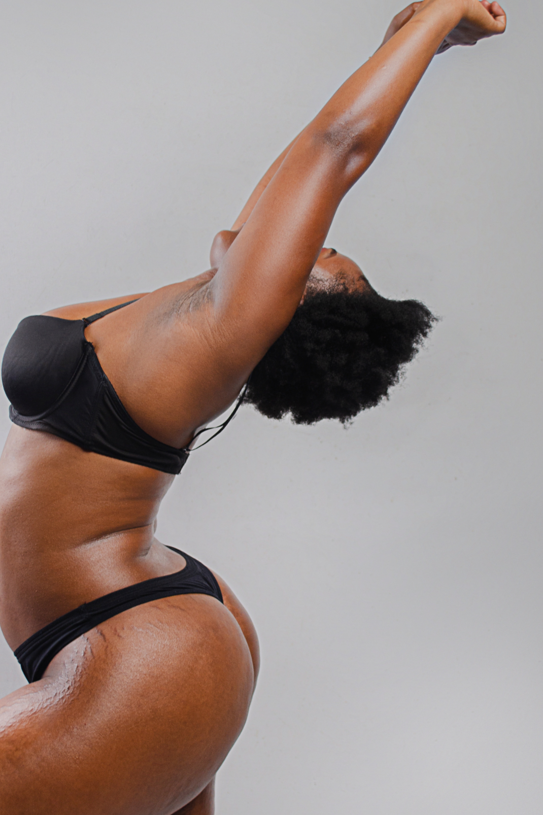 Woman stretching — representing strength and movement as part of crash menopause recovery and the Load First™ approach.