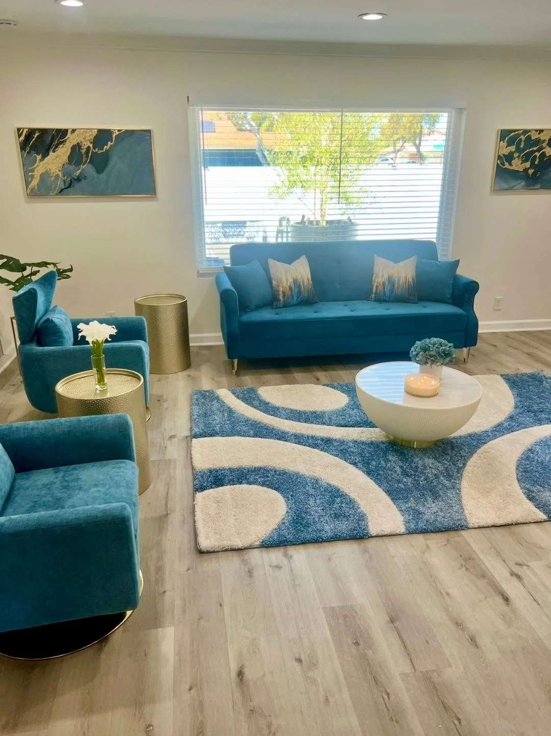 "Balanced furnishings and thoughtful styling create a comfortable, space for socializing and entertaining guests."