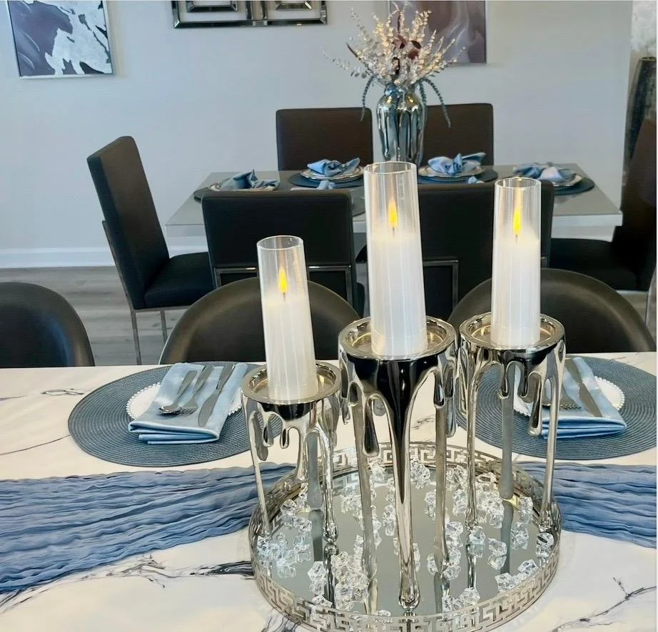 "Candle styling adds warmth and ambiance, enhancing the refined aesthetic of the kitchen design."