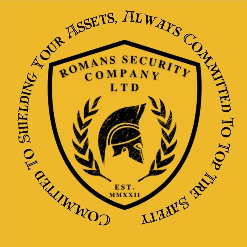 A black shield with the text 'ROMANS SECURITY COMPANY LTD' and a Spartan helmet inside a laurel wreath. Surrounding the shield is the text 'COMMITTED TO SHIELDING YOUR ASSETS, ALWAYS. COMMITTED TO THE TOP OF THE TOP.' on a yellow background.