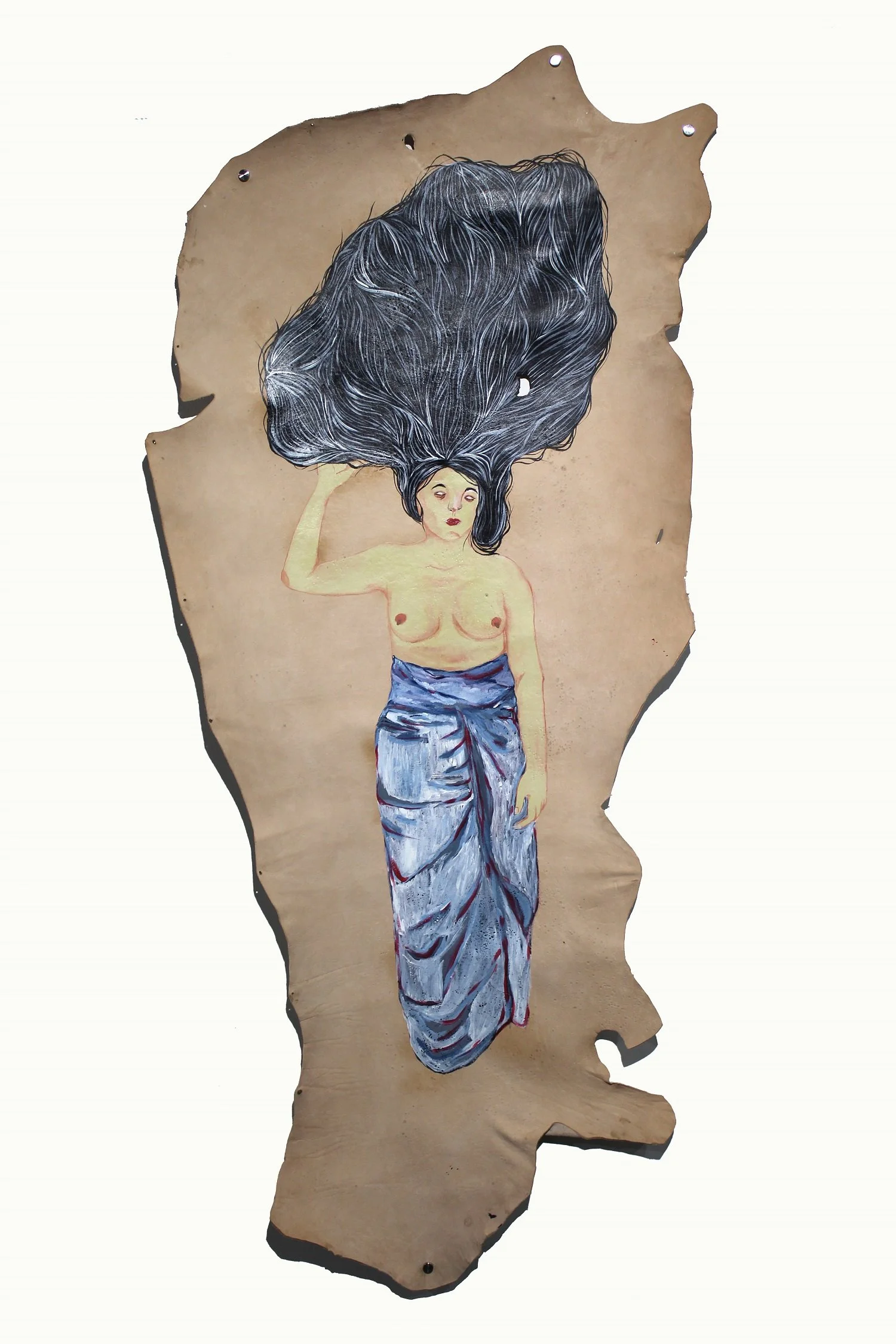 A mixed-media artwork of a woman with long flowing dark and white hair, wearing a traditional blue and gray draped garment, appears on a torn piece of cardboard.