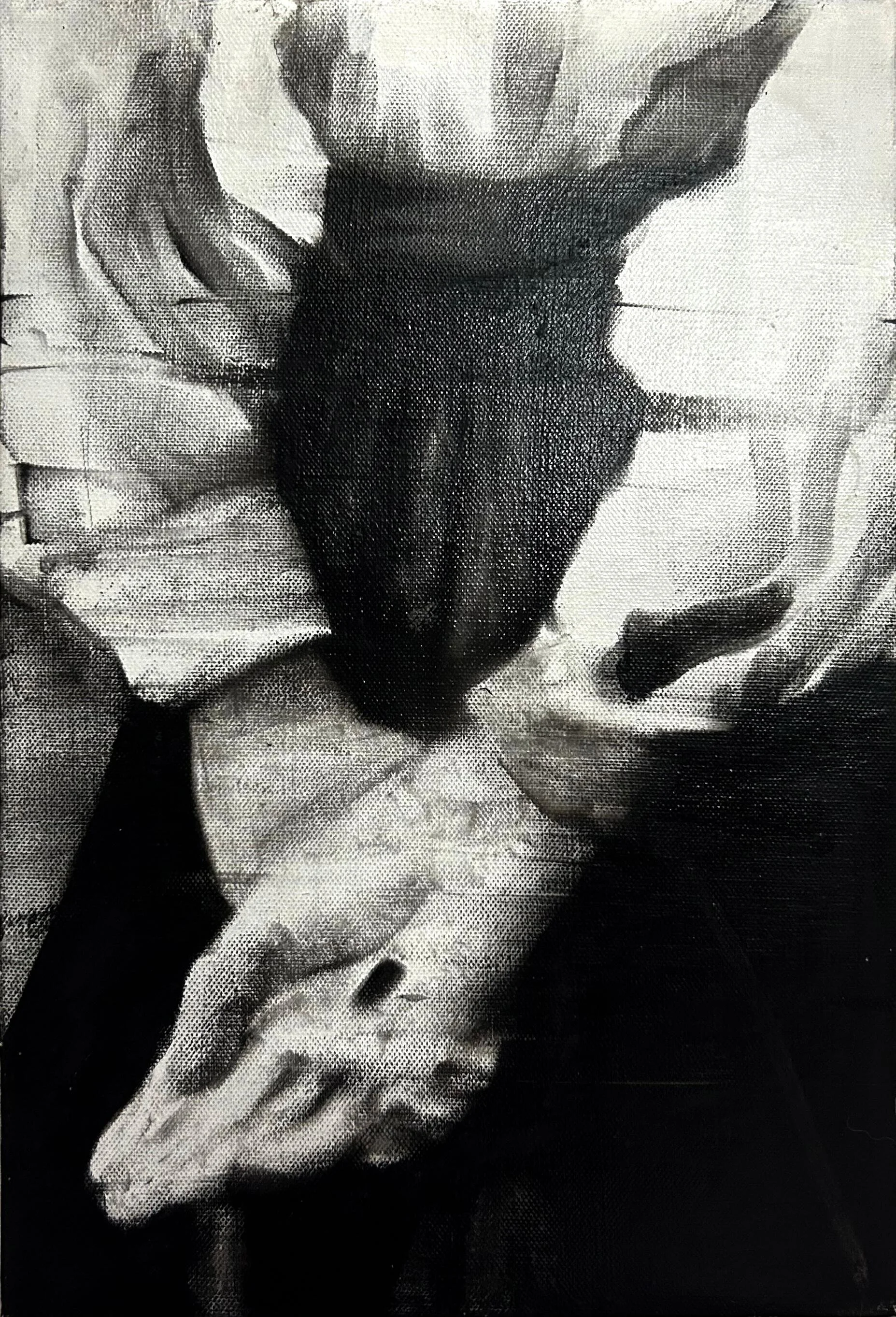 Black and white photo of a person holding a fish, with the person's face partially visible, wearing a patterned shirt.