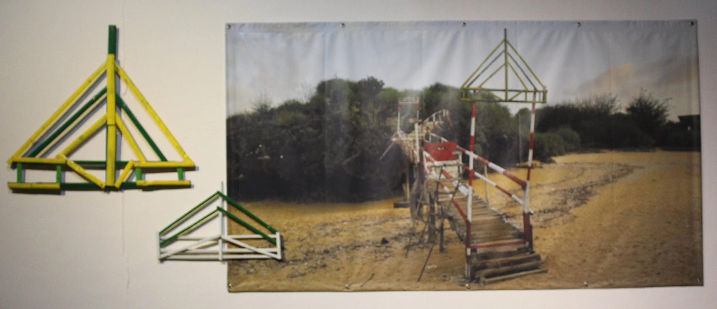 Souvenirs From Krakal Beach 
 Print on plastic banner | Enamel on bamboo 
 111 cm x 199 cm | 69 cm x 97 cm & 33 cm x 51 cm, 2018 