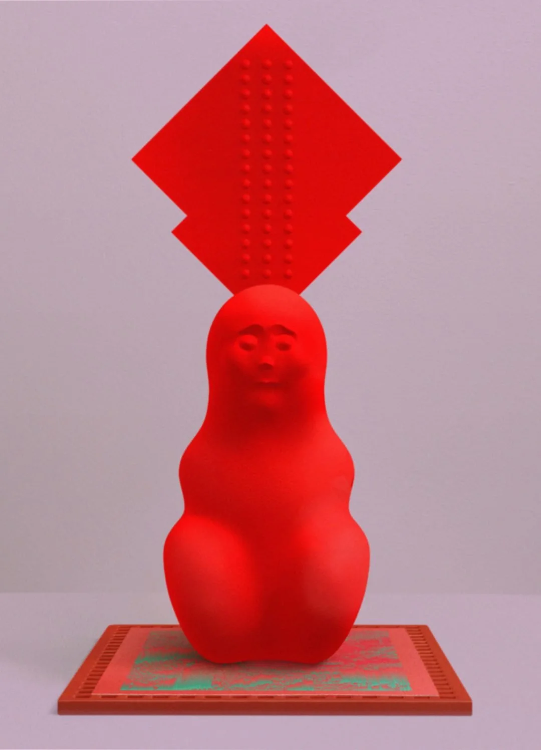 Red sculpture with a face, placed on a patterned base, topped by an abstract red geometric shape with textured details.
