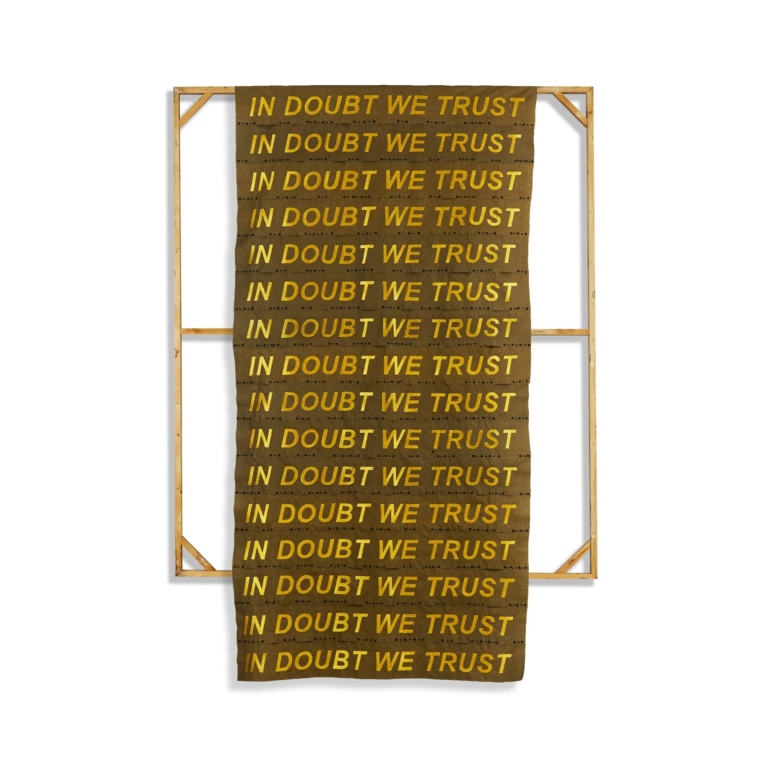 Banner with a brown background and yellow text repeated in multiple rows that says 'IN DOUBT WE TRUST,' framed by a wooden stand.