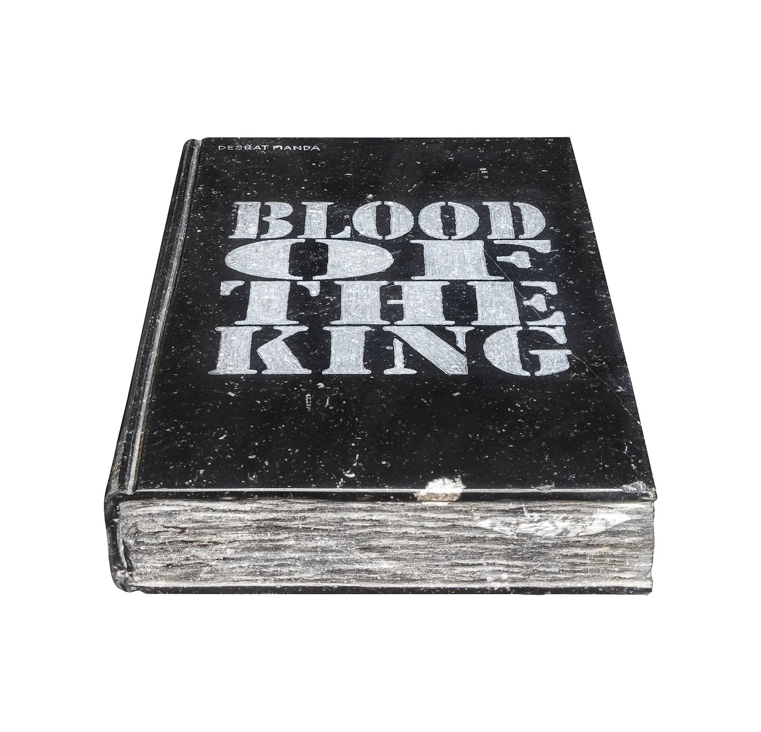A black book titled 'Blood of the King' with a distressed appearance and white lettering, with some spots and wear on the cover.