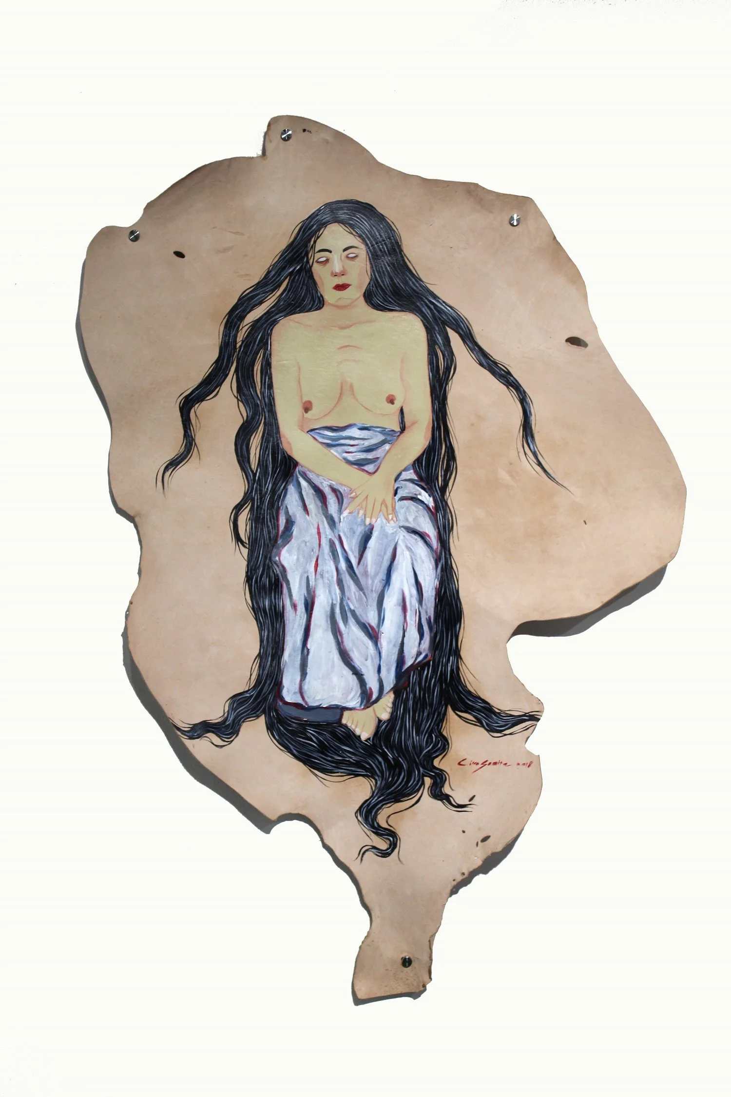 A painted metal silhouette of the state of Illinois featuring a woman with long dark hair, topless, with her hands over her stomach, and wearing a striped skirt, against a plain white background.
