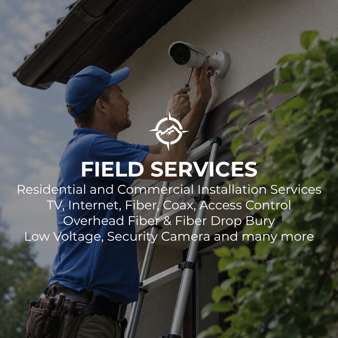 A technician installing a security camera on the exterior wall of a house.