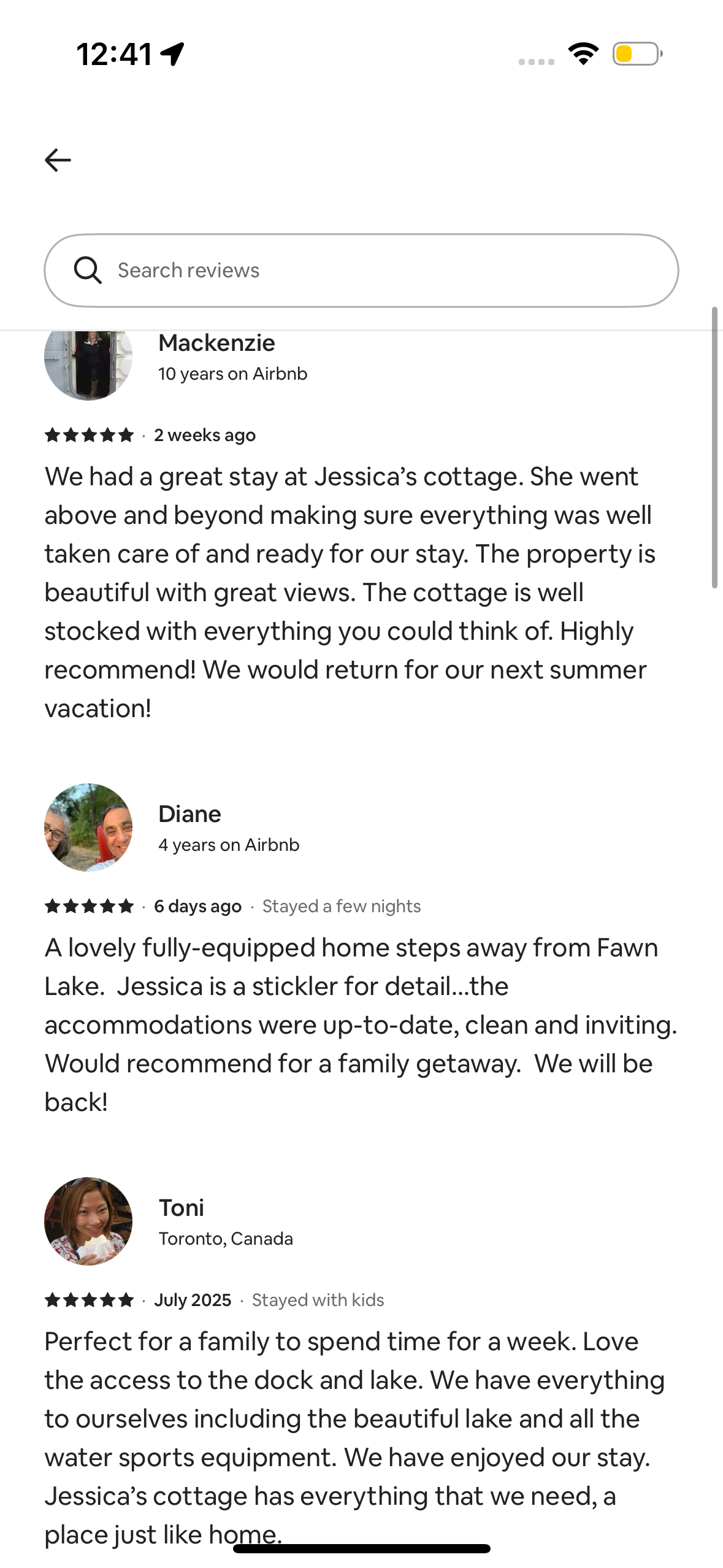 Screenshot of positive Airbnb reviews for a cottage near Fawn Lake, featuring comments about the well-stocked amenities, beautiful views, and family-friendly environment.