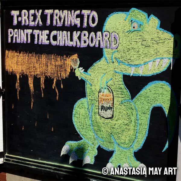 T-rex trying to paint the chalkboard, but the. arms are too short and they can only do a small portion