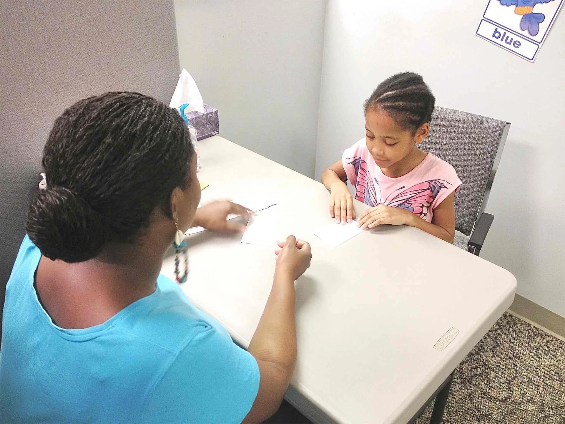 Woman tutoring girl