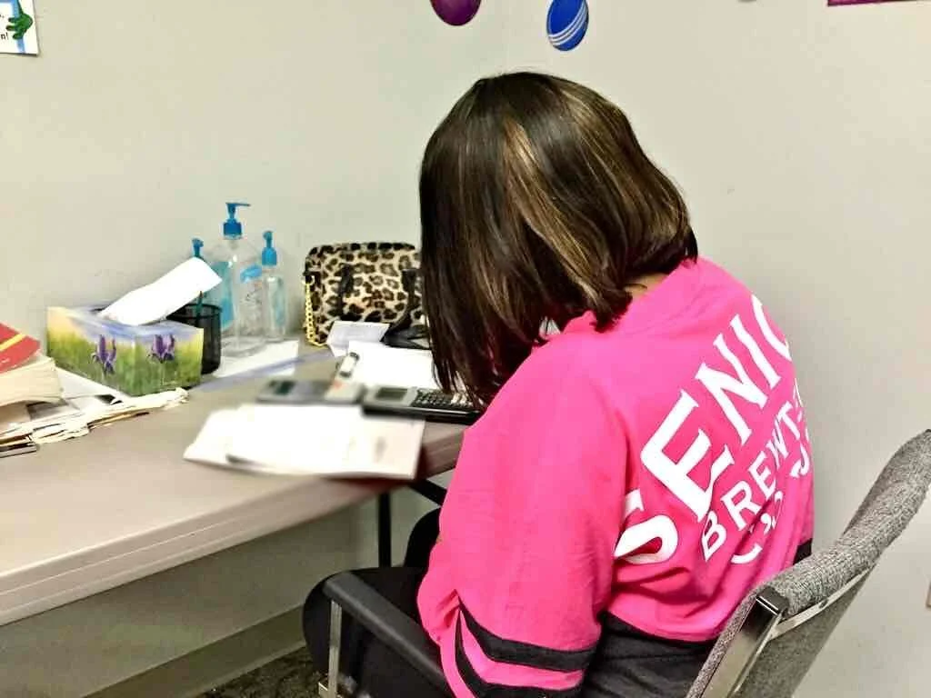 Teenager working at desk