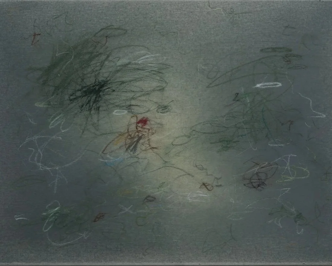 Child's colorful scribbles and drawings on paper, including a face with hair, eyes, nose, and mouth, with scattered lines and shapes.