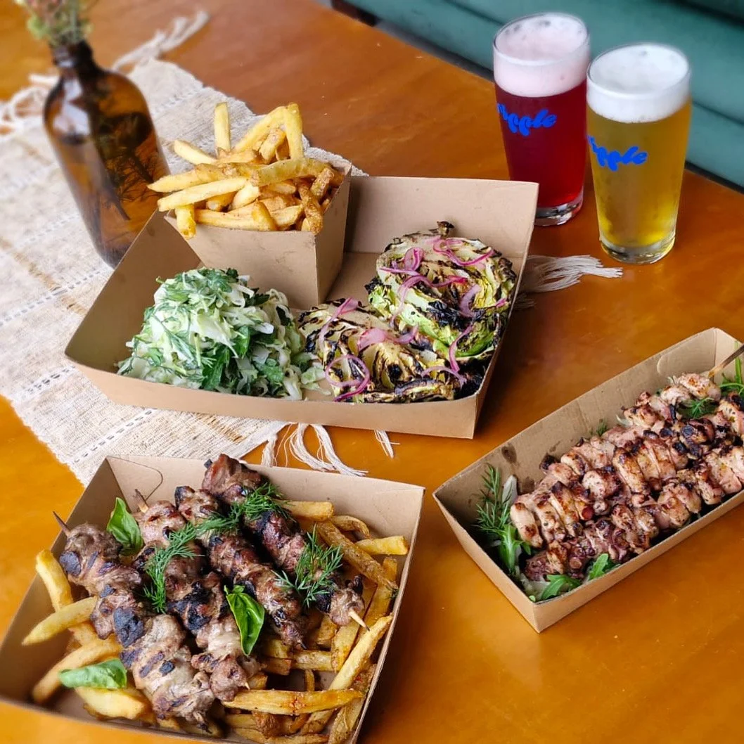 Octopus and pork skewers, hand cut chips, salad. 