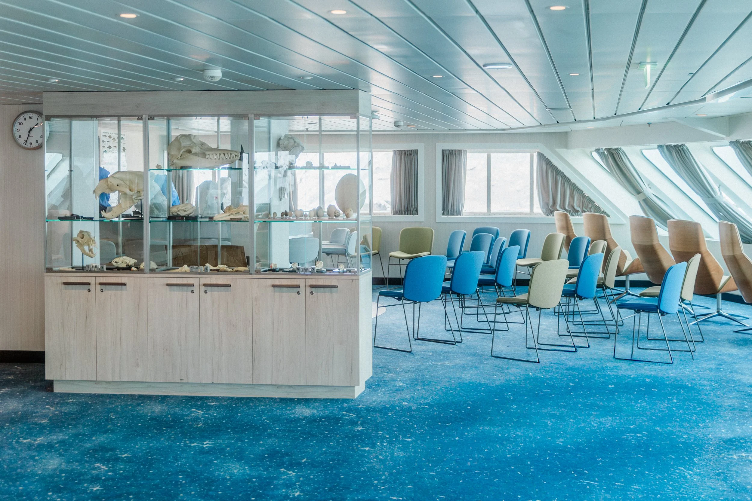 Science Centre on HX Expeditions ship with specimen displays and seating for workshops and learning.