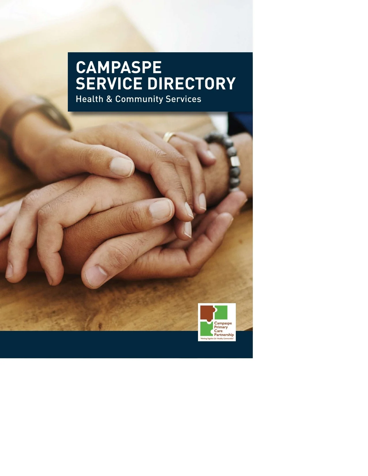 Cover of a health and community services directory with an image of hands clasped together on a wooden surface.