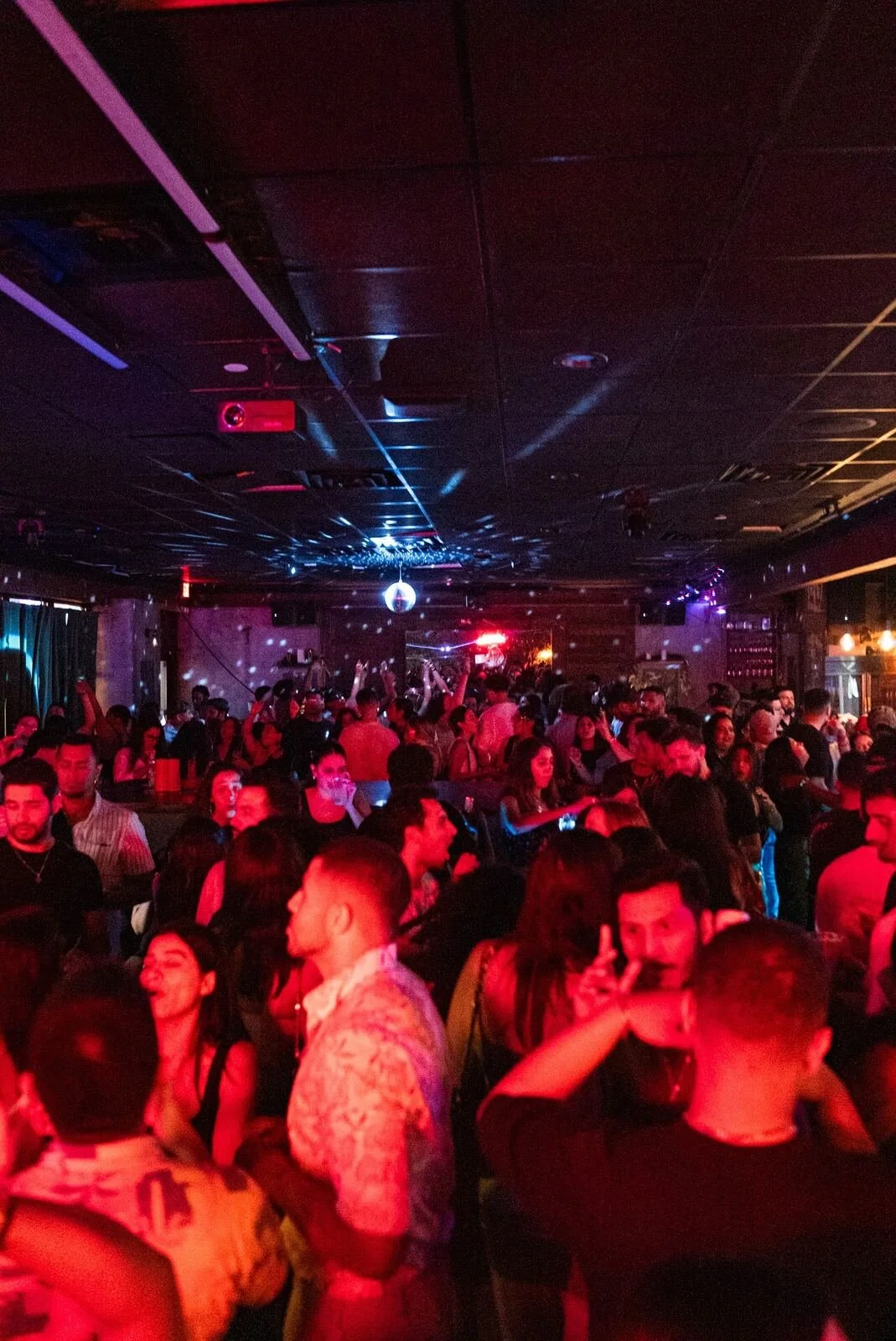 Throwback: packed dance floor under red lights at Republic in Williamsburg, Brooklyn