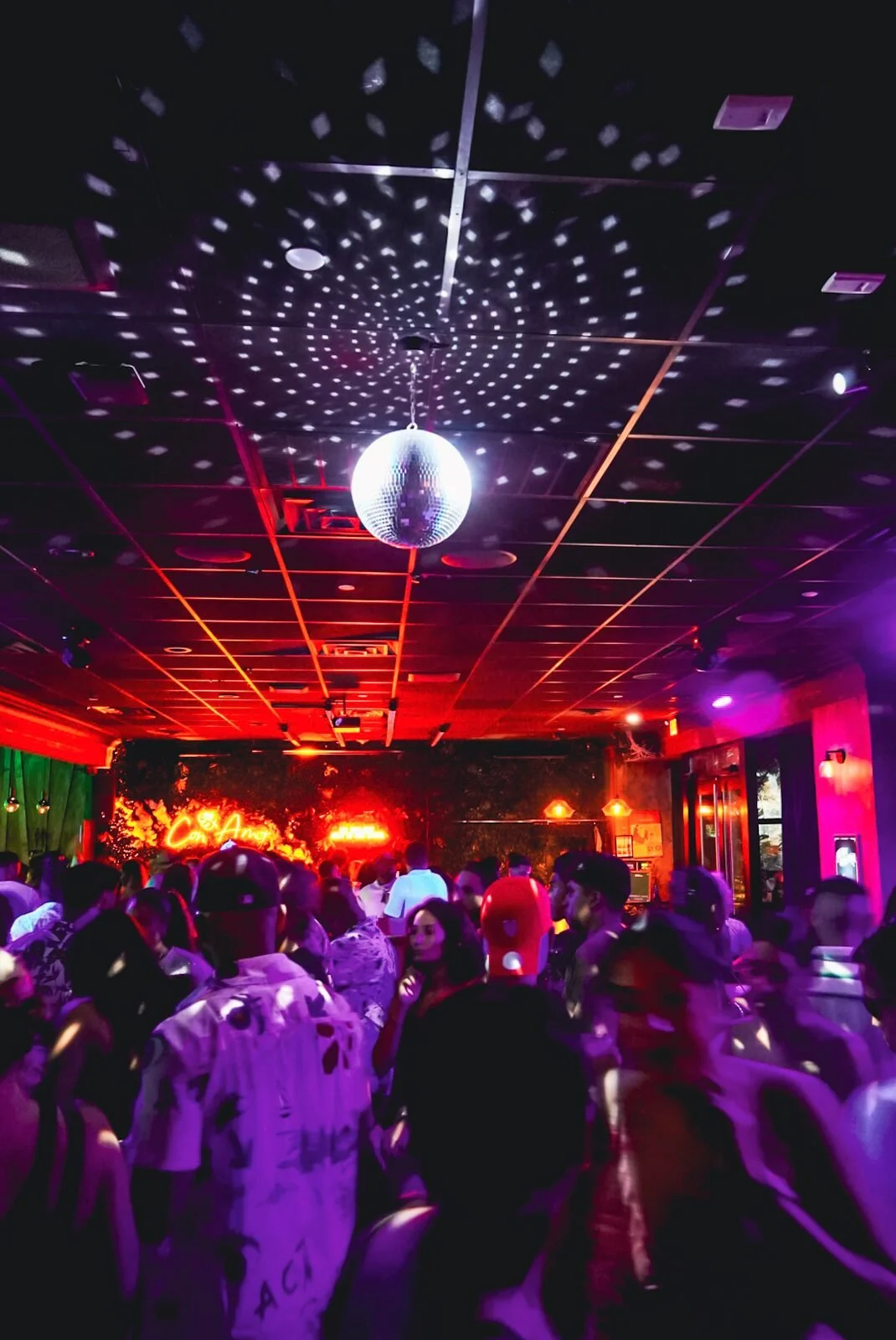 Throwback: disco ball scattering light over a dancing crowd at Republic in Williamsburg, Brooklyn